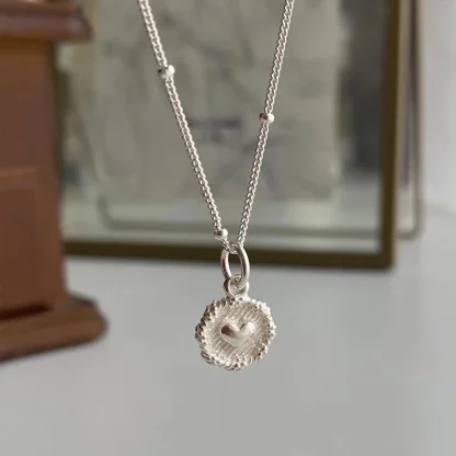 Elegant Necklace with Embossed Heart Design - Image 5