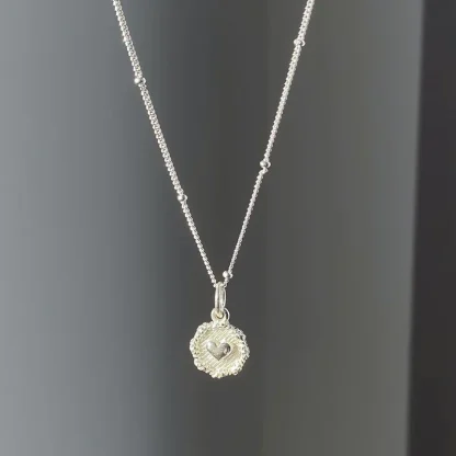 Elegant Necklace with Embossed Heart Design